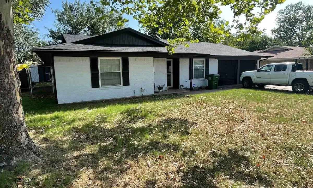Professional roofing crew working on a residential roof in LaSalle